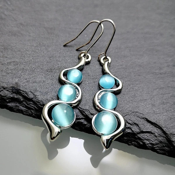 Boucles d'oreilles pendantes en cristal bleu