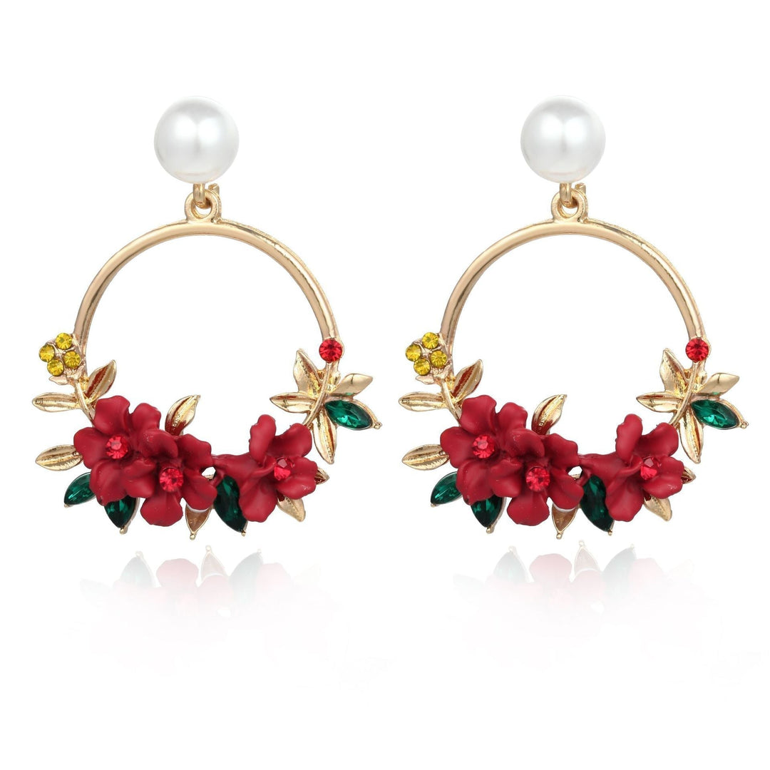 Boucles d'oreilles élégantes en or avec fleurs et perles