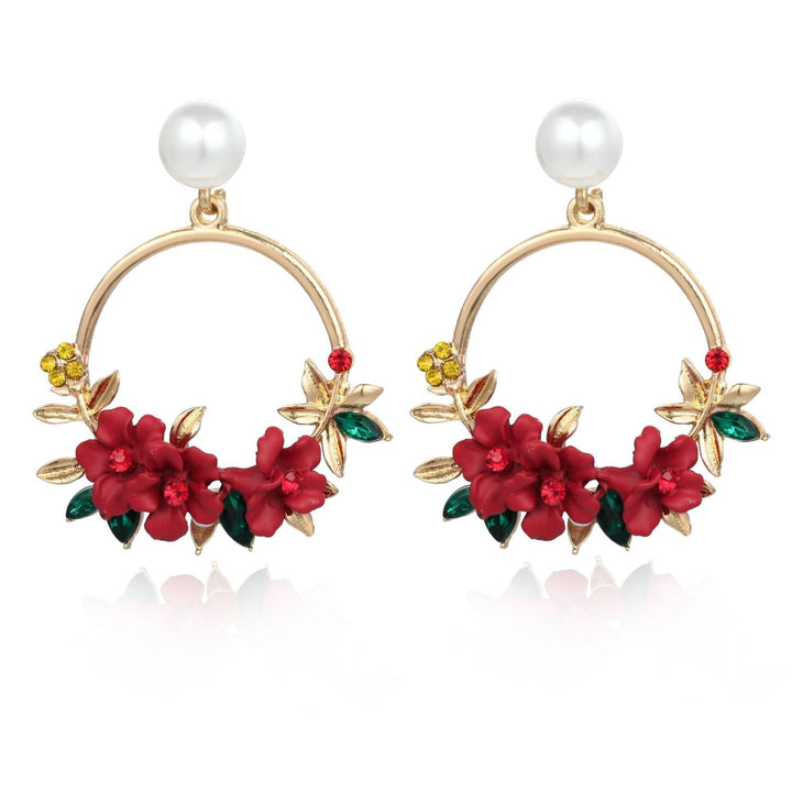 Boucles d'oreilles élégantes en or avec fleurs et perles