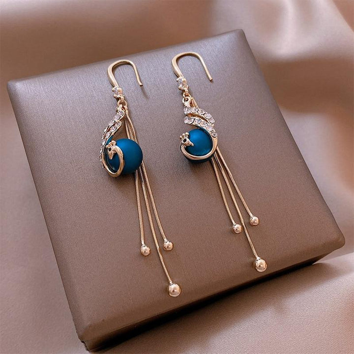 Boucles d'oreilles festives avec perles bleues