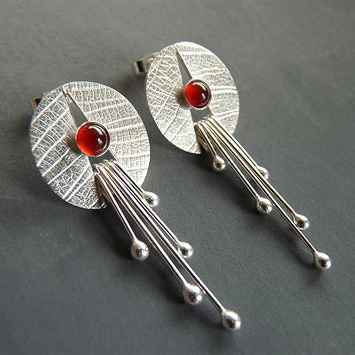 Boucles d'oreilles suspendues en pierre rouge creuse
