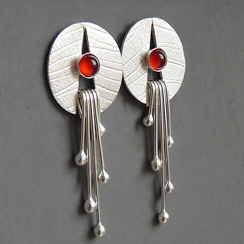 Boucles d'oreilles suspendues en pierre rouge creuse
