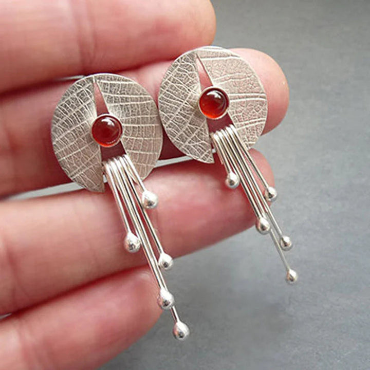 Boucles d'oreilles suspendues en pierre rouge creuse