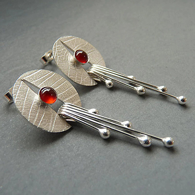 Boucles d'oreilles suspendues en pierre rouge creuse