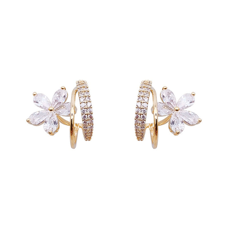 Boucles d'oreilles florales en or avec zirconia étincelant