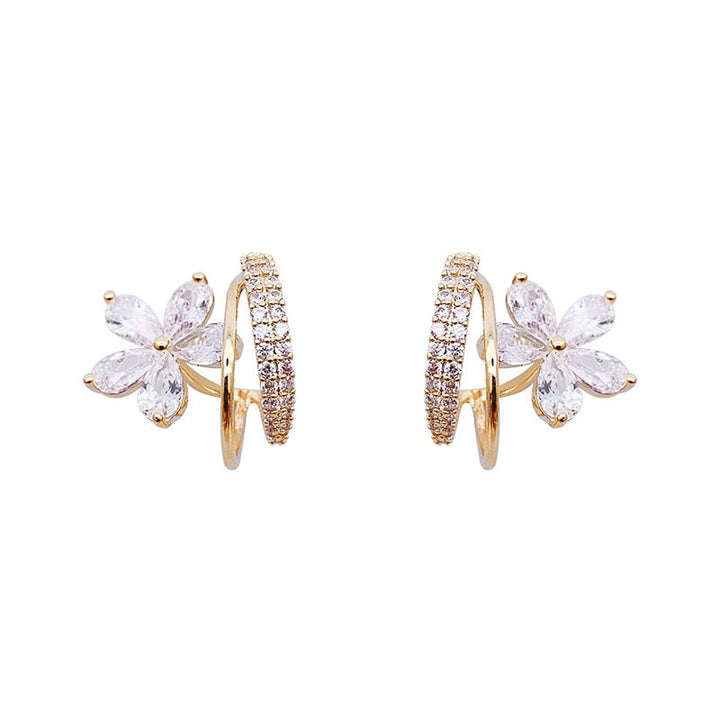 Boucles d'oreilles florales en or avec zirconia étincelant