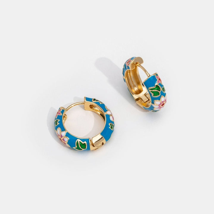 Boucles d'oreilles dorées en forme de fleur circulaire